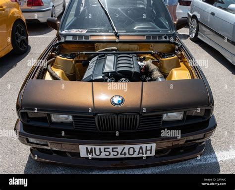 Beautiful Brown Bmw E30 With Square Headlights And An Open Hood Stance