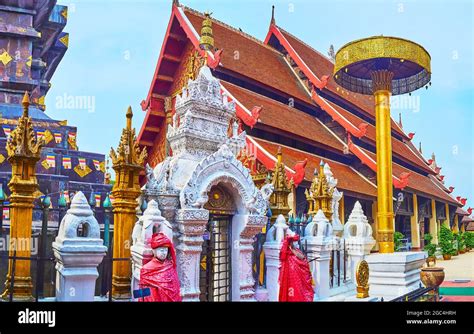 The Pyathat Gable Roof Of The Viharn Luang Is Seen Behind The Gilt