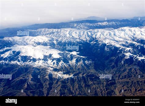 Aerial View Of Majestic Snow Covered Peaks In Tianshan Mountain