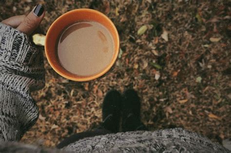 Premium Photo Low Section Of Person Holding Coffee Cup