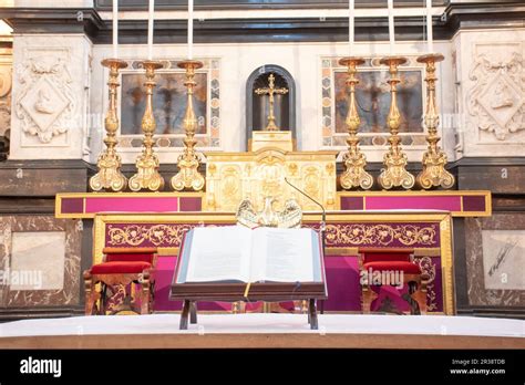 Bible Overlooking Grand Altar In Cathedral With Large Candles Stock