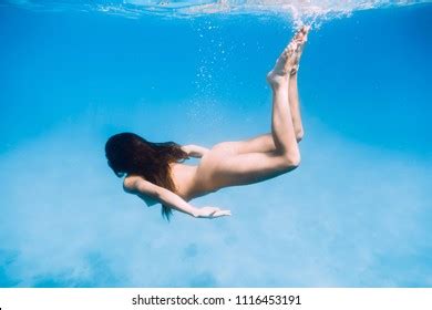 Slim Naked Woman Swimming Ocean Underwater Stock Photo 1116453191