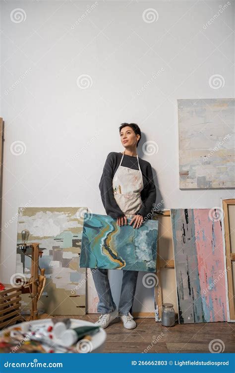 Brunette Artist In Apron Holding Drawing Stock Image Image Of