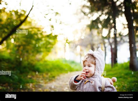 Funny Shy Little 2 Year Old Boy Giggling In The Park At The Sunset