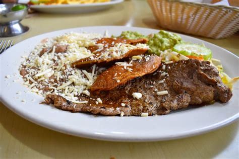 Dish With Roasted Cecina And Potosina Enchiladas Accompanied By Beans