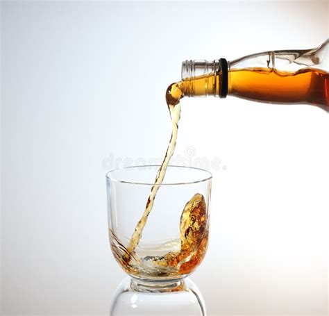 Whiskey Being Poured Into Glass Royalty Free Stock Image Image 23578976