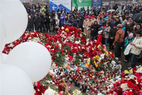 Russia Mourns Victims Of Concert Hall Tragedy As Thousands Gather In