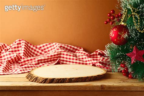 Empty Wooden Log Board On Rustic Table With Christmas Tree And Red