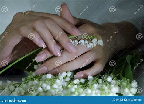Woman Nails Manicure With Flowers Nails Covered With Nude Nail Polish Stock Photo Image Of