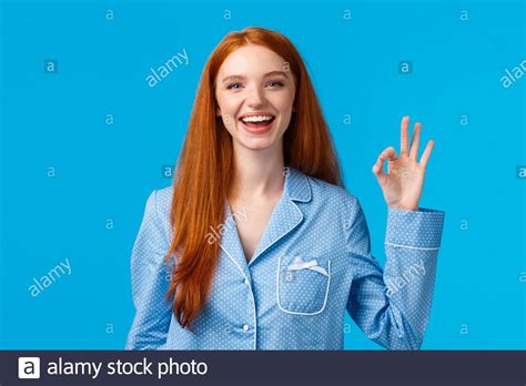 Alright No Worries Anymore Cheerful And Relieved Smiling Happy Redhead Girl In Nightwear