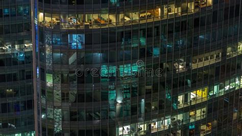 Office And Residential Buildings Windows Illuminated At Night Timelapse