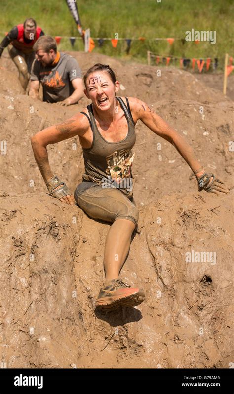 Muddy Girl On Mud Mile Obstacle On The Tough Mudder Obstacle Course