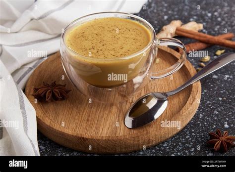 Traditional Indian Drink Masala Tea With Spices On A Black Stone