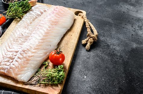 Premium Photo Fresh Raw Cod Loin Fillet With Thyme