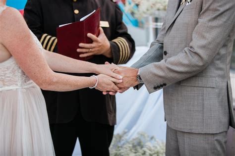 Premium Photo Midsection Of Couple Holding Hands At Wedding Ceremony