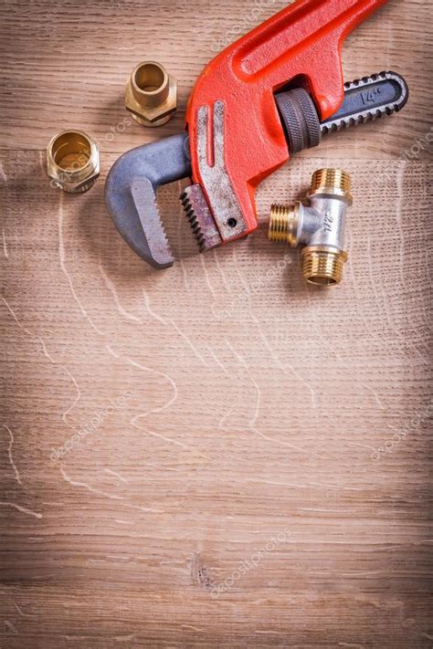 Monkey Wrench And Brass Pipe Connectors — Stock Photo © Mihalec 71281553