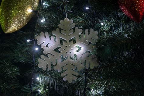 Premium Photo Snowflake On A Christmas Tree