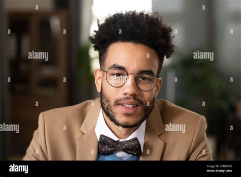 Portrait of positive handsome young black man with afro hairstyle ...