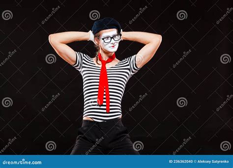 Portrait Of Male Mime Artist Performing Isolated On Black Background