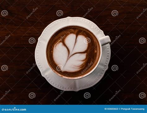 Closeup Cup Of Hot Coffee Tulip Latte Art On Wood Table Vintage Stock