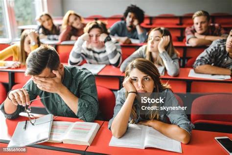 Large Group Of Bored Students At Lecture Hall Stock Photo Download