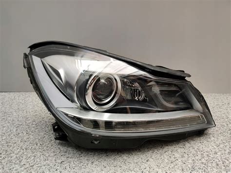 MERCEDES W204 LIFT LAMPA BI XENON ILS PRAWA PRZEDNIA A1669002800