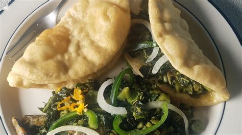 Callaloo With Saltfish And Fried Dumpling Taco Style Finger