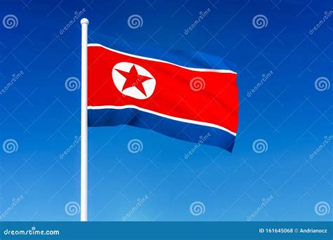 Waving Flag Of North Korea On The Blue Sky Background Stock