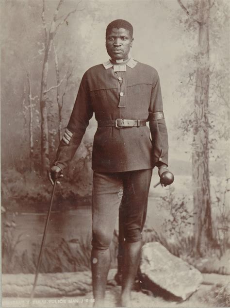 Sergeant X Zulu Police Man Barefoot Man In Uniform In Studio Setting