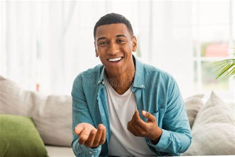 Headshot Of Laughing Millennial African American Man Gesturing