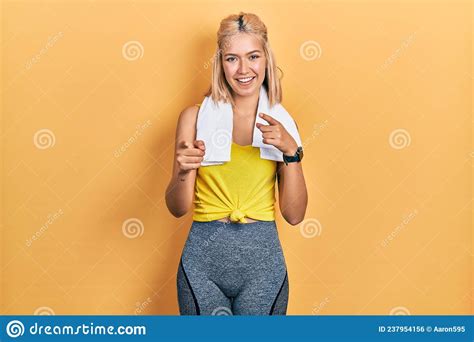 Beautiful Blonde Sports Woman Wearing Workout Outfit Pointing Fingers