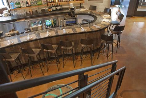 An Empty Bar With Chairs Around It