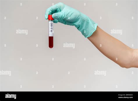 Hand In Latex Glove Holding Blood In Test Tube Close Up Stock Photo Alamy