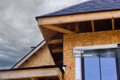 An Under Construction House Has Its Joist Framework With Plywood