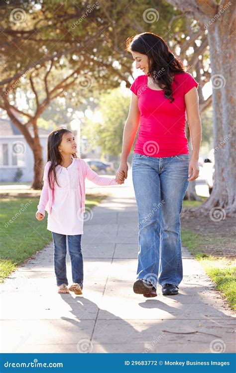 Mother And Daughter Walking Along Path Stock Photo Image Of Together