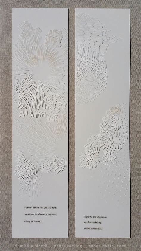 Two White Cards With Intricate Designs On Them