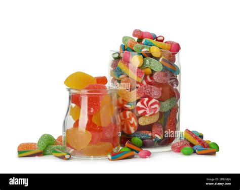 Glass Jars With Different Candies On White Background Stock Photo Alamy