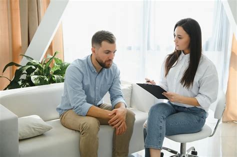 Premium Photo Female Psychologist Making Note While Patient Talking