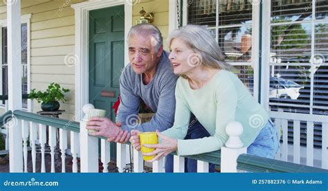 Happy Senior Couple Sitting On Porch Talking Stock Footage Video Of