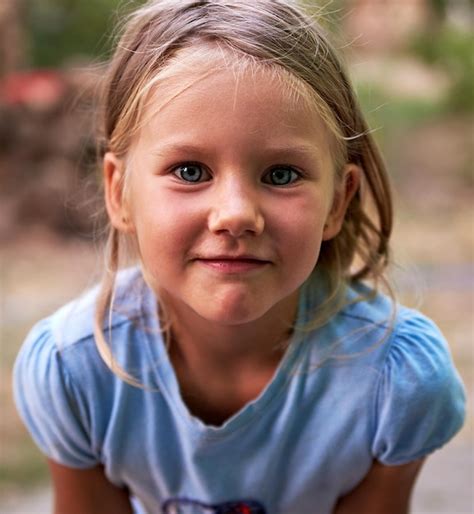 Premium Photo Close Up Portrait Of Girl Smiling While Standing Outdoors