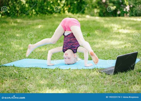 Girl Child Doing Sport Workout Outdoor Online. Video Yoga Stretching on ...