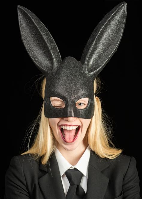 Portrait Of A Happy Woman In Bunny Ears Winking Closeup Of Winking