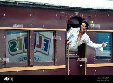 Elvis Impersonator Kingsley Rock Poses For A Photograph Before Boarding