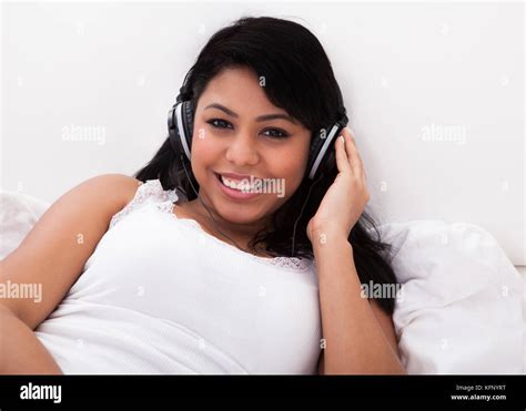 African Girl Lying Listening To Music Hi Res Stock Photography And