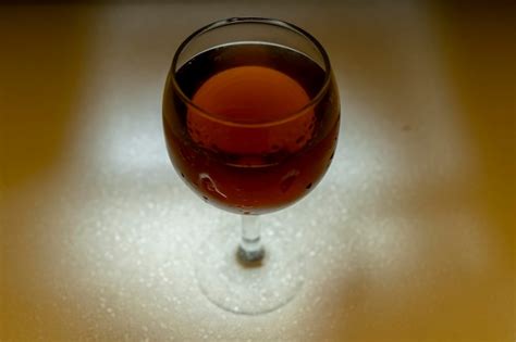 Premium Photo Wine Glass Full Of Red Wine In A White Table