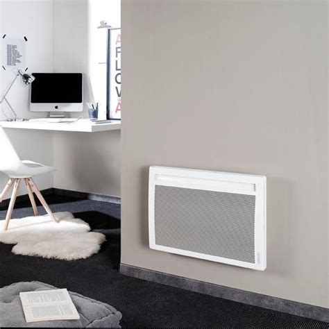 An Air Conditioner Sitting On The Floor Next To A Wall