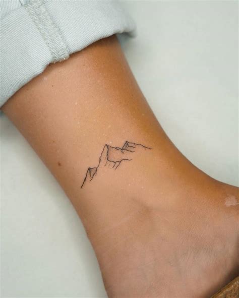 Minimalistic Style Mountains Tattooed On The Ankle