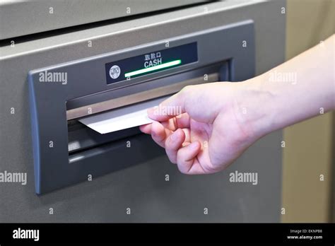 Taking Money From Atm Machine Stock Photo Alamy