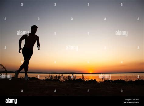 Running Man Silhouette In Sunset Time Sport And Active Life Concept