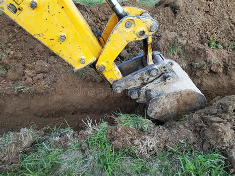 mini excavator dig  trench stock photo image  ground micro